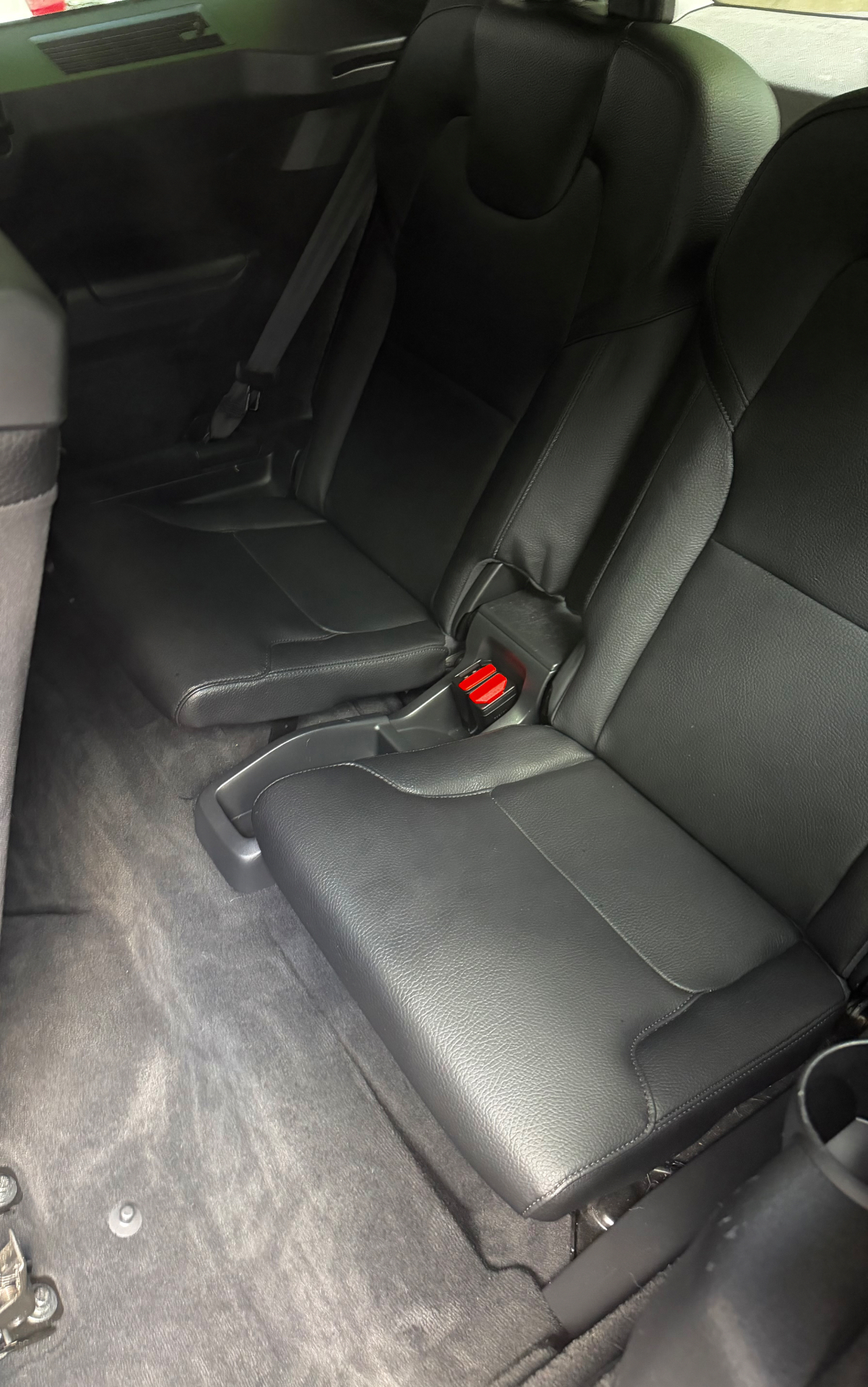 Truck rear seats and carpet before and after pet hair removal — after