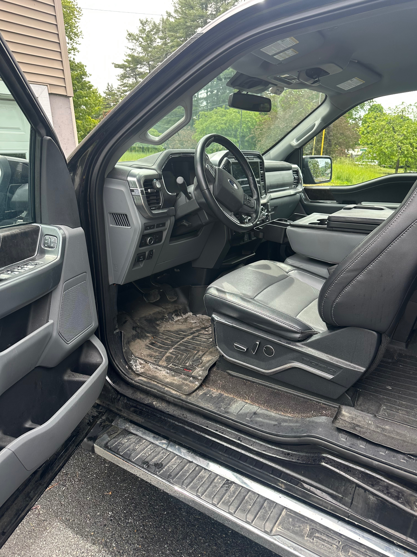 Ford F-150 front interior before and after deep cleaning — before