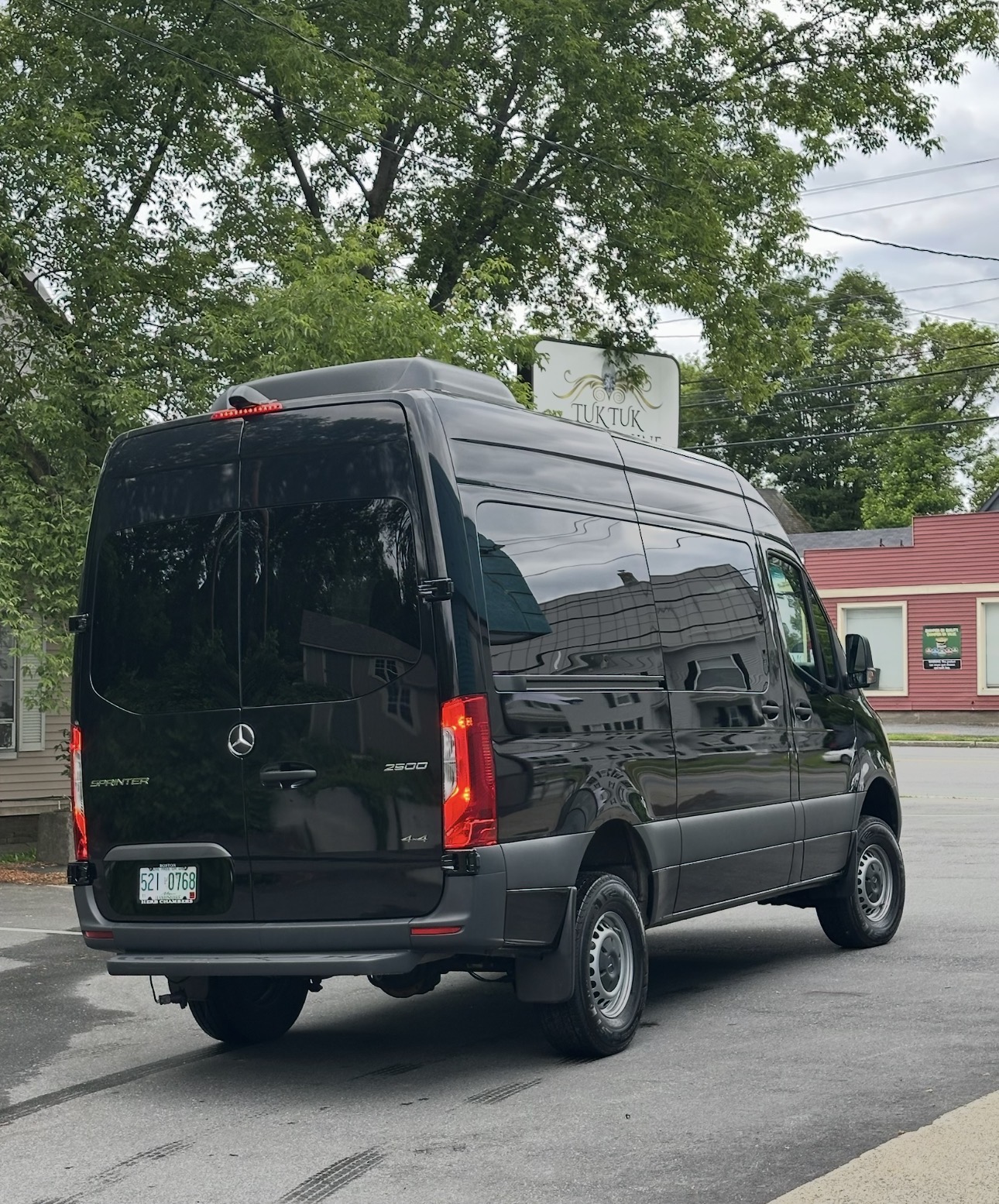 Black Mercedes Sprinter rear three-quarter after exterior detail