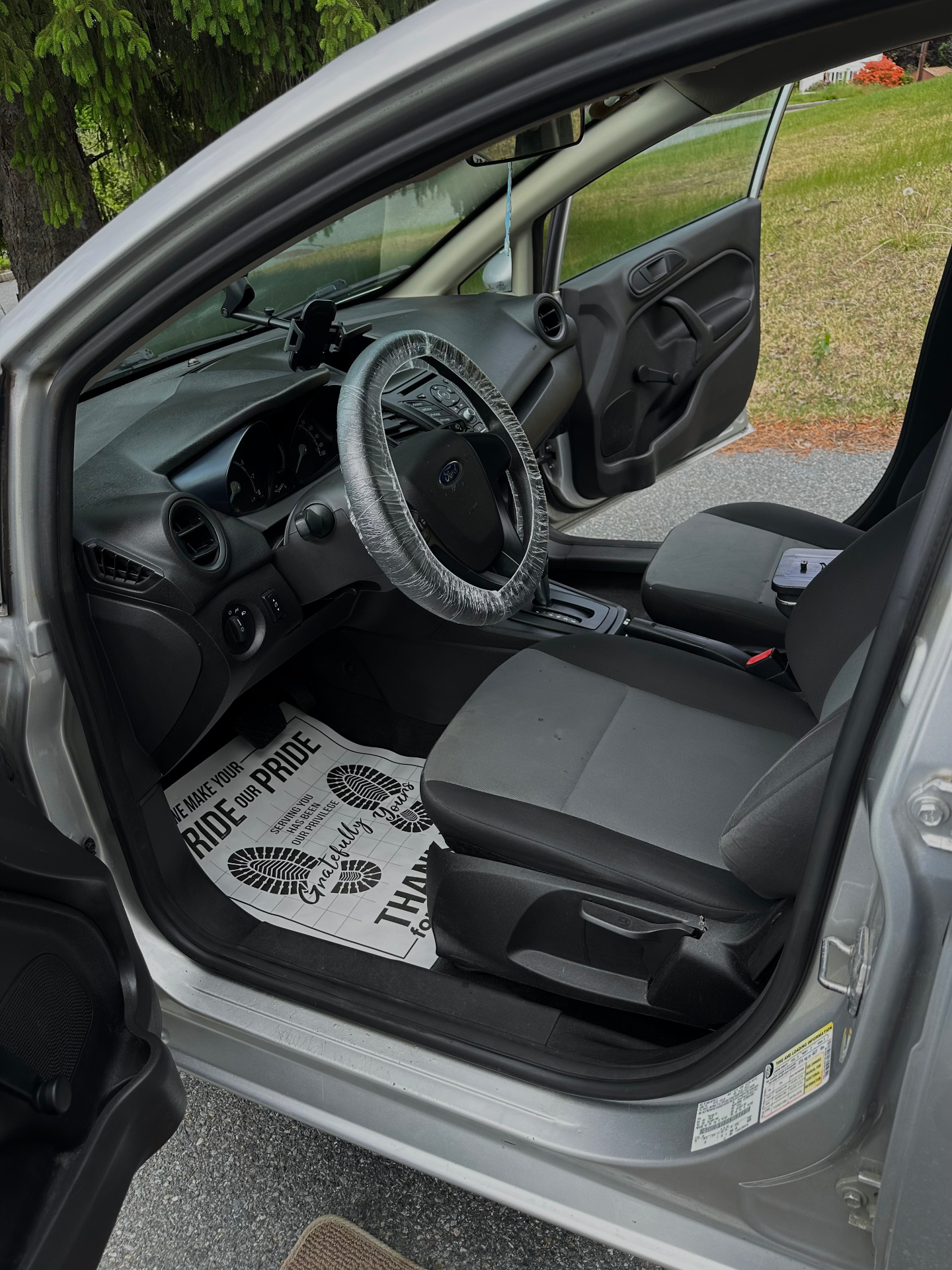 Ford Taurus front interior before and after deep cleaning — after