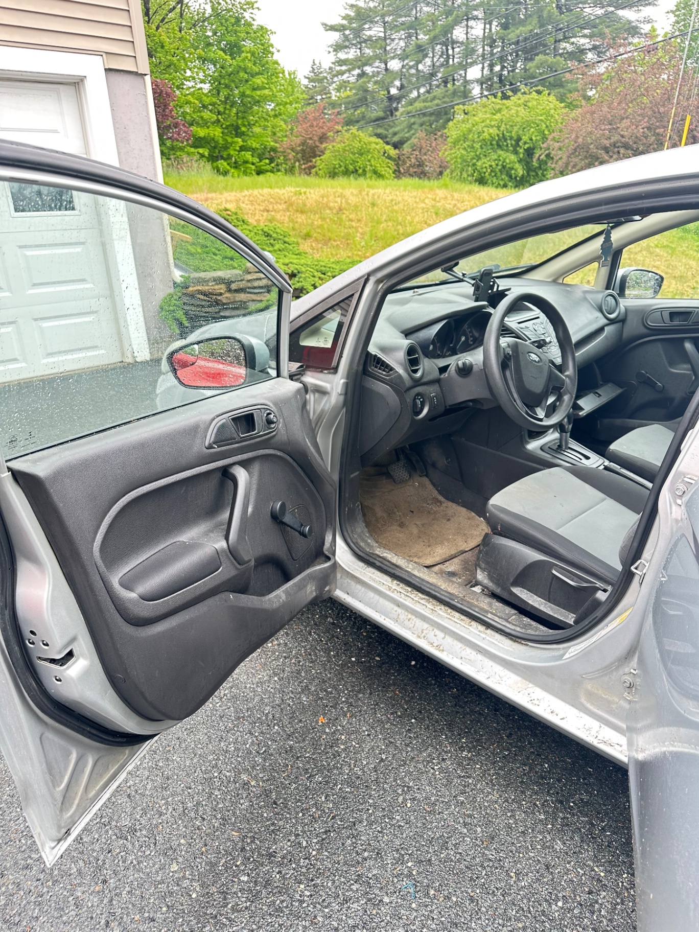 Ford Taurus front interior before and after deep cleaning — before