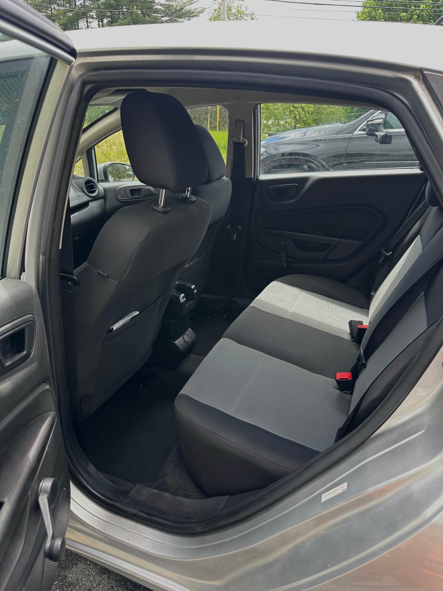 Ford Taurus rear interior before and after deep cleaning — after