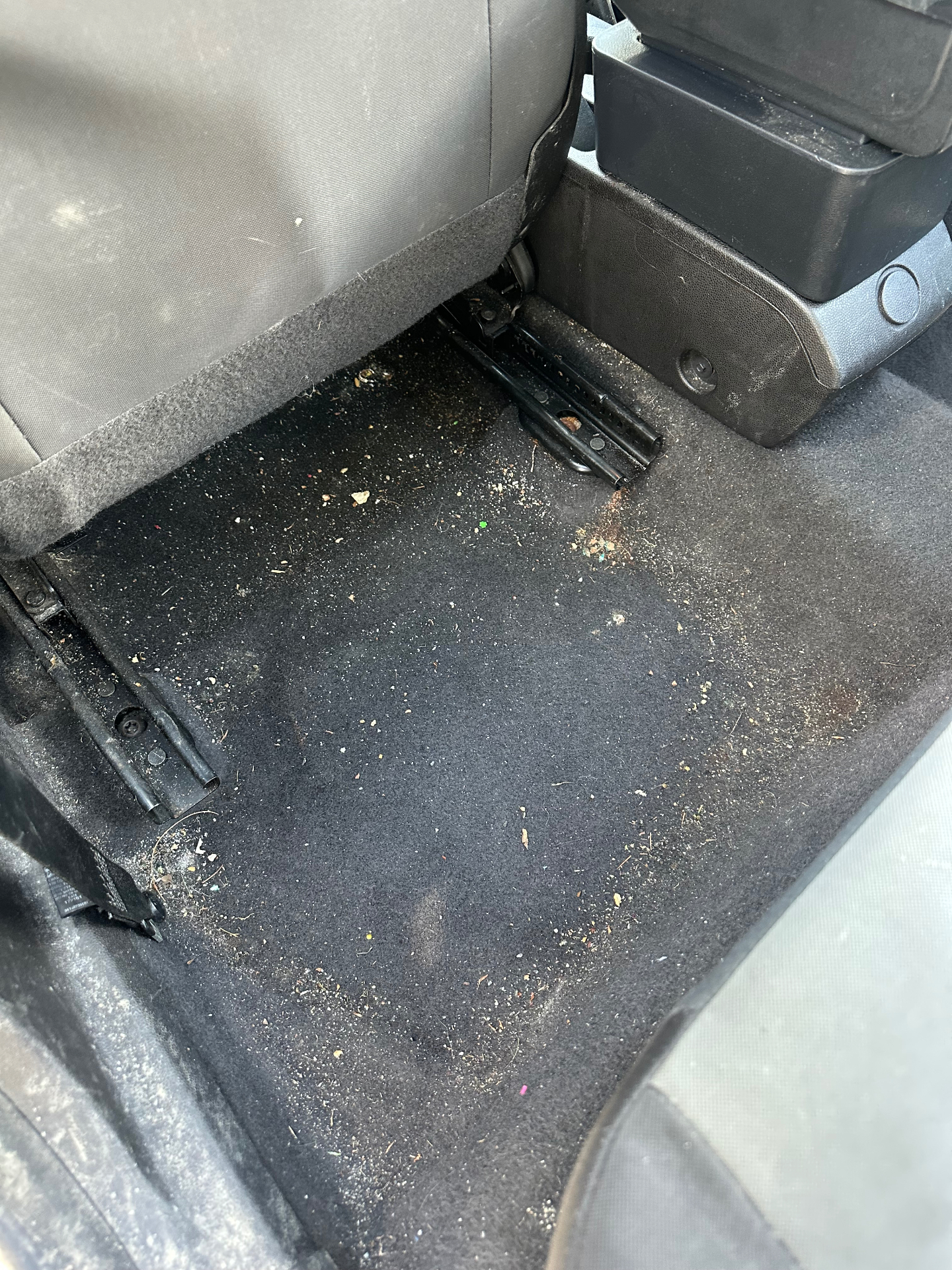 Ford Taurus rear interior before and after deep cleaning — before